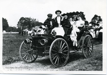 Family in their 'horseless carriage' possibly in Greenbrier County, West Virginia.