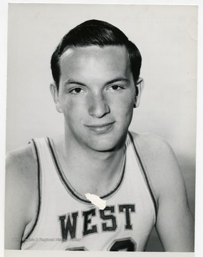 Portrait of John Lesher, member of the West Virginia University Basketball Team. 'Taylor Publishing Company, Job Number 07206, Picture Number 1, Page Number 223. Copyright 1963 by Laughead Photographers, Dallas, Texas. Reproduction permitted by all processes except photography.'