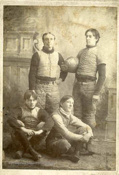 Group portrait of West Virginia University Freshman Football Team. 'Standing: Sally Rowan and Pat Orr. Resting: Ed Anderson and Fred Mitchell. Backfield of Freshmen Team, 1895.'