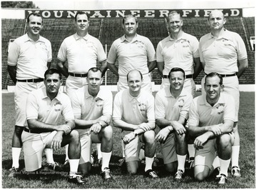 WVU football coaching staff.  Front row, from left:  Jimmy Ragland, Dale Evans, Phil Callicut, Bobby Bowden, Hayden Buckley.  Back row:  Jack Fligg, Marshall Taylor, Head Coach Jim Carlen, Bill Hicks, Dick Inman.