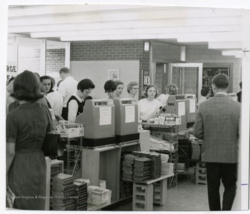 Customers are shopping at the old University Bookstore, located behind the Law Building, Colson Hall, West Virginia University.