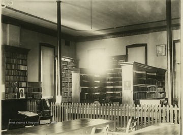 View of library in Martin Hall where the lecture room is now located.  Miss Hough was librarian.