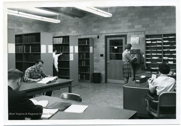 Students are studying in the Mathematics-Physics Research Library which was established in August 1961 and was located in Room 305 Hodges Hall.