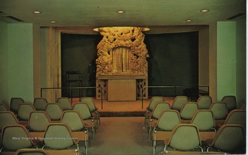 'The all-faith chapel at WVU Hospital, Morgantown, is for the use of patients and visitors.  The allegorical figures over the altar are the work of the noted Chicago sculptor, Milton Horn.'