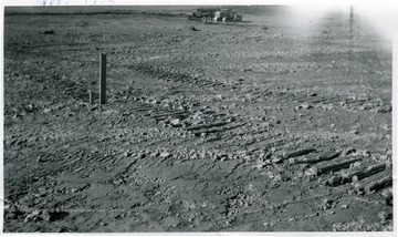 'Where they removed the top soil for the university Medical School. Notice the bulldozer's tracks.'