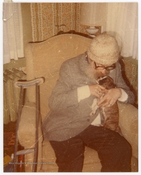 Grubb is pictured with the dog of journalist Joyce Jackson of Morgantown, W. Va.