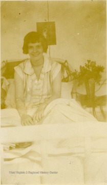 'In bed'.  Biographical information on Hester Harr obtained from her niece, Debra Harr. Hester Harr was a patient at Hopemont Hospital for approximately 10 years. After contracting tuberculosis, she was admitted in the Spring of 1926 and discharged 1936. She was born January 10,1906 in Buena, W. Va. near Canaan Valley, one of five children (the third and last daughter) of John R. and DeLarie Harr. Hester graduated from Petersburg High School in 1925. She entered Shepherd College in the fall of that year. In the spring of 1926, she transferred to West Virginia University. Her brother, Guy Harr, born 1909, was also a student at WVU at the same time. He also contracted tuberculosis and entered the Hopemont Sanitarium. He died at Hopemont in 1934. After leaving Hopemont, Hester Harr married Harold Yokum of Keyser on December 31, 1938. They made their home in Ridgeley, W. Va. near Short Gap, W. Va. (on Rt. 28 South of Cumberland). They had no children. Harold Yokum died in 1953. Hester Harr died in 1987 of complications of pneumonia. She is buried in the Maple River Cemetery in Petersburg, W. Va