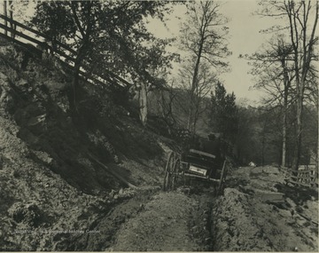 'Negative by John L. Johnston, print by F. A. Molby.  Johnston named it 'West Virginia Road System'.  L. L. Friend and Friend E. Clark say this was the road past the Experiment Station into Falling Run on the Campus of West Virginia University, about 1890 perhaps.'