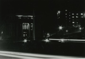 Night view of Oglebay Hall and plaza on left; Women's Hall on right.