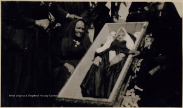 Woman in casket.