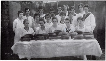 Students with loaves of bread.