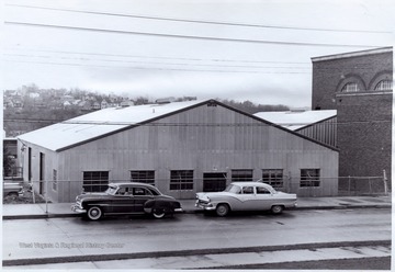 'Occupied in March, 1957, this L-shaped building beside the Field House contains Civil Engineering's Fluid Mechanics and Sanitary Laboratories, the Mechanics Department's Testing Laboratory, the Shop serving both departments, and the Testing Division of West Virginia State Road Commission.' Image from page 17 of 'Progress Report on Civil Engineering Submitted to Education Committee, Engineers Council for Professional Development 29 West 39th Street, New York 18, New York by College of Engineering, West Virginia University, Morgantown, West Virginia.' Original photo may be found in this publication located in the WV Collection book collection. 