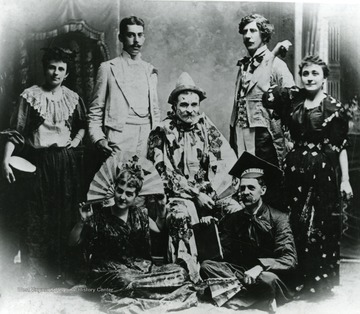 Jane Willard and Jesse Smith standing at left, Clara Gould (wife of Waitman Barbe) seated with fan.