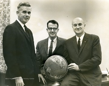 Cleve Benedict at left, man in center unidentified.