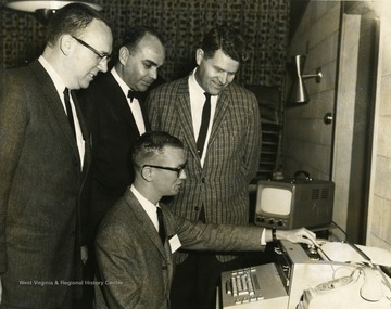 Robert Slonager, second from left; Charles N. Cochman, third from left.
