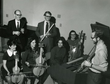 'The WVU Collegium Musicum will perform in concert at 8:15 p.m. Thursday, March 25, in the WVU Medical Center Auditorium. The 20-member group is directed by Harry Elzinga, far right.  Other members of the picture are from left, Cora Horacek, of Route 4 Morgantown; Assistant Professor Mary Stringham, of 1217 Corvet Ave., Morgantown; Linda De Giustino of Mount Storm (foreground); Maribel Meisel, of Fairmont (far right); and in rear Jon Hall, of St. Marys and Tom Mosser.'