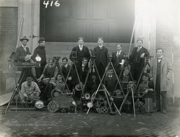 'Photo taken on the steps of Science Hall. The engine in the picture was built by R.A. West in Fife Cottage.'