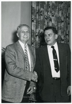 Dean Van Liere is standing to the left of an unidentified man, at the Fraternity Convention in Miami.