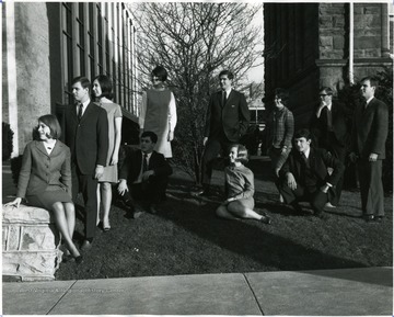 Members of Executive Council take a break on a yard between Stewart Hall and Mountainlair.