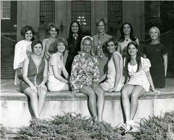 Female members of Panhellenic council pose in front of Wise Library.