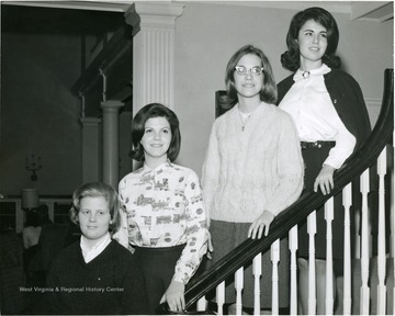 Members of Associated Women Students Dorm Council pose on a staircase of Elizabeth Moore Hall: Second from left is Billie Adams.
