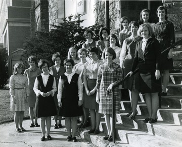 Members of Kappa Phi, Methodist Women pose out side of the Wesleyan church on the corner of North High Street and Willey Street.