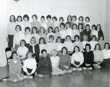 Members of Kappa Phi, Methodist Sorority line up in rows for a group portrait.