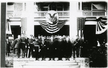 'PRESIDENT TAFT VISITS MORGANTOWN, NOV. 1, 1911- President William Howard Taft, front row center, delivered the inaugural speech Nov. 1, 1911, when Thomas Edward Hodges became president of the University. Pictured in front row, left to right are Daniel B. Purinton, Gov. W.E. Glasscock, President Taft, Mr. Hodges and Dr. I.C. White. Pictured at left on porch are (unknown) Frank Cox, left, and Henry Green, the editor of The Post. The first two men pictured in the back row could not be (named, third unsure) is James L. Lakin, fourth Maj. Butts, hero who lost his life in sinking of Titanic; fifth, a Mr. Sigwart; sixth George C. (Rodgers-unsure); seventh, H.C. Batton; eighth and ninth, unidentified: tenth, Harry Carspecken; and others, M.L. Brown, William Williams, (unknown), Benjamin Rosenbloom, Frank B. Trotter and Dr. A.M. Buckhannon. The men in uniform were members of Gov-(the rest is unclear).