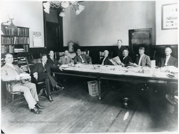 President Purinton is seated on the far left.