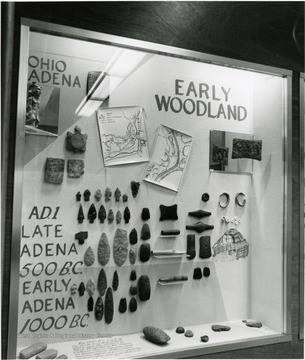 Exhibit includes stone tools, arrowheads, adornments, and other representative items from the Late Adena and Early Woodland eras.