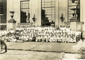A group photo from summer coaching school in 1938 taken in front of Wise Library.
