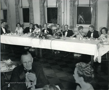 The speaker's table at the Inaugural dinner at Women's Hall.  Left to right, President Stewart, Mrs. William G. Thompson, Mr. Salvati, Mrs. Vannevar Bush, Mr. Thompson, Mrs. James B. Conant, Dr. Bush, Mrs. Raymond E. Salvati, Dr. Conant and Mrs. Irvin Stewart.