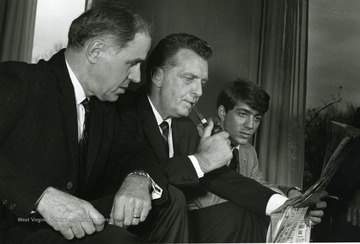 Chet Huntley (center) sits with Prof. Walter Rockenstein (left) and John Esposito (right.)
