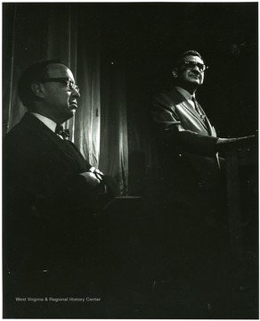 'History Symposium of Feb. 22-24 headlined Kentucky author Jesse Stuart and Arthur Schlesinger. Schlesinger is shown at left listening to Dr. John A. Caruso, chairman of the planning committee of the symposium at the Metropolitan Theatre.'