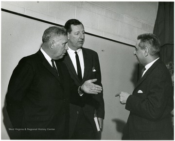 'Famous Kentucky writer Jesse Stuart (left) chats with WVU prof. Ruel Foster (Center) and planning committee chairman John Caruso (right) at 'Lessons of History' symposium Feb. 23, 1967.'
