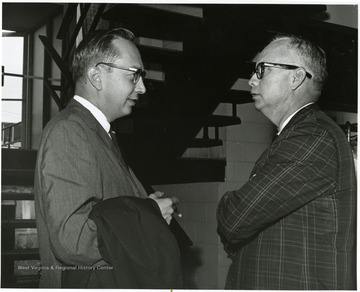 'Donovan H. Bond, exec. dir. of the 100th Ann. Observance (right) chats with Harry Ernst, then Washington correspondent of the Charleston Gazette, at the June 29-29, 1967 "Man and His Community" symposium.'