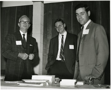 'Donovan H. Bond, exec. dir of the 100th Ann. observance (left), Jim McCauley, research and graduate assistant of the 100th Anniversary Office (center), and Frank Carlomagno, assistant dir. of the WVU Foundation, Inc. (right) are shown at the "Man and His Community" symposium, June 28-29, 1967.'
