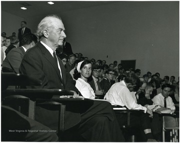 'Dr. Linus Pauling, two time winner of the Nobel Peace Prize, is shown listening to an address at the Oct. 6, 1967 Science Writing Symposium.  He later addressed the symposium.'