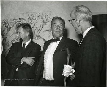 Dr. T. H. Hunter, chancellor for medical affairs at the University of Virginia (center), is shown at the Nov. 28, 1967 seminar on the Future of Undergraduate Education at WVU, chatting with two WVU professors, Edward Steele, Jr., Prof. of History (left), and Earl Boggs, Prof. of Education, Director of Admissions, and Assistant to the President (right).' 