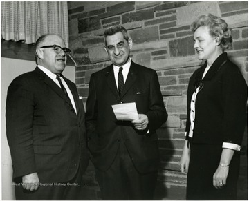 'Famed Harvard historian Oscar Handlin (left) chats with WVU Professor John Caruso (center)and WVU Board of Governors member, Mrs. Gilbert Bachmann prior to Handlin's Feb. 23, 1967 lecture at the 'Lesson's of History' Symposium.'