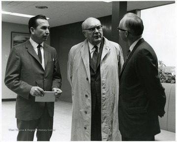 'Famed international figure Paul-Henri Spaak (center) speaks with WVU Editor John Luchok (left) and 100th Ann. Exec. Director Donovan H. Bond (right) before Spaak's Nov. 2, 1967 address.'