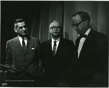 'Noted historian Arthur Schlesinger (right) chats with planning committee chairman John Caruso (left) and 100th Ann. Exec. director Donovan H. Bond (center) at Lessons of History symposium Feb. 22, 1967.'