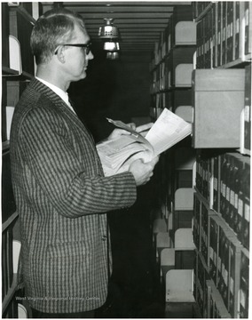Shetler is looking through the collection on the tenth floor, Archives and Manuscripts section of the W. Va. Collection.