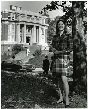 'Parents: Congressman and Mrs. Harley O. Staggers. Senior Nursing major. Activities: vice president of student body, and Kappa Delta social sorority. In the background is Oglebay Hall.'