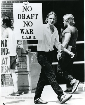Stewart Fisk holding sign.