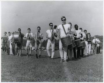 A scene from WVU band practice:  A saxophone player near center wearing shorts is Gary Sypolt.
