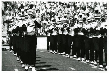 WVU marching band performs at football game.