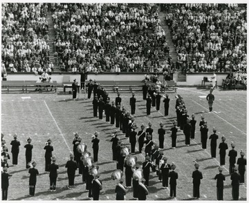 WVU marching band performs on the field on a game day.