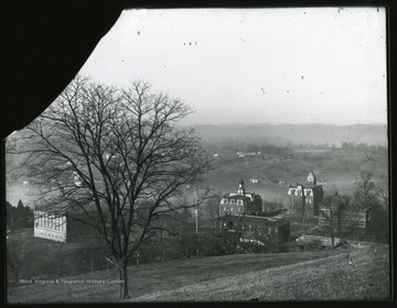 A view of downtown campus from Fife Street: Commencement Hall on the left;  Science Hall (Chitwood Hall), Woodburn Hall and Martin Hall with a clock tower forming Woodburn Circle; building across from Woodburn Circle is Agricultural Experimental Station.