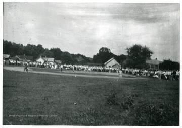 A game of baseball played on the 4th of July in 1913.